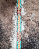 Leather belt with floral patterns on a textured background