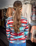 Texas Rain Fitted Pullover being styled and modeled on women in front of store setting.