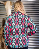 Person wearing a colorful patterned pullover with a metallic background