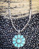 The Lola Flower Pendant Fashion Necklace on beans and wheat.