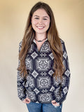 A model wearing the Down In The Hills Fitted Pullover in a tan background.