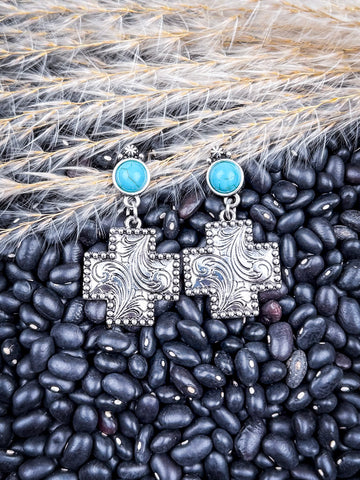 Dangle earrings shown on beans and wheat