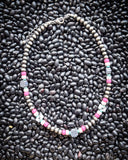 The Chance Navajo Style Pearl & Bead Necklace displayed on beans.