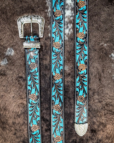 Belt with turquoise and brown floral pattern on a textured brown background