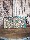 Back view of the Western Swing Wristlet on a wood backdrop.