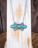 The Bullseye Fashion Necklace displayed on wood backdrop.