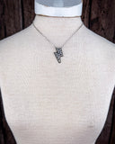 The Checkered Lightning Pendant Fashion Necklace displayed on mannequin.