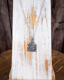 The Lightning Flush Pendant Fashion Necklace displayed on wood backdrop.