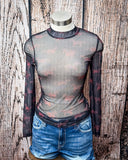 The Black Horse Mesh Top displayed and styles on mannequin in front of wood backdrop.