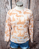The Desert Burnout Mesh Top styled on a mannequin displayed In front of a wood backdrop.
