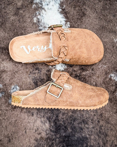 Iris Tooled Slip on Mule in Tan by Very G displayed on cowhide.