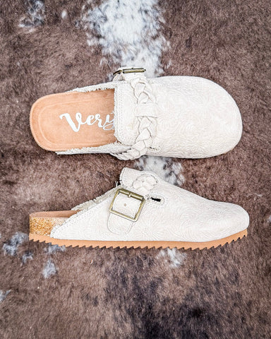 Iris Tooled Slip on Mule in Cream by Very G displayed on cowhide.