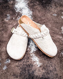 Iris Tooled Slip on Mule in Cream by Very G displayed on cowhide.