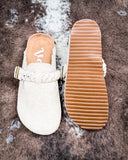 Iris Tooled Slip on Mule in Cream by Very G displayed on cowhide.