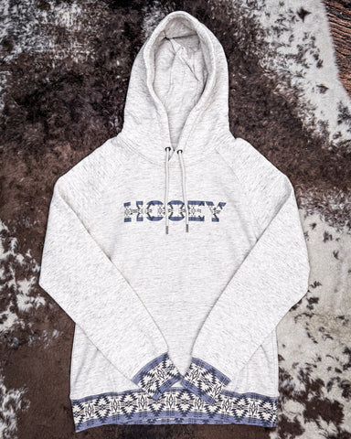 Front view of the Trophy Ladies Hooey Hoodie in Oatmeal on cowhide.