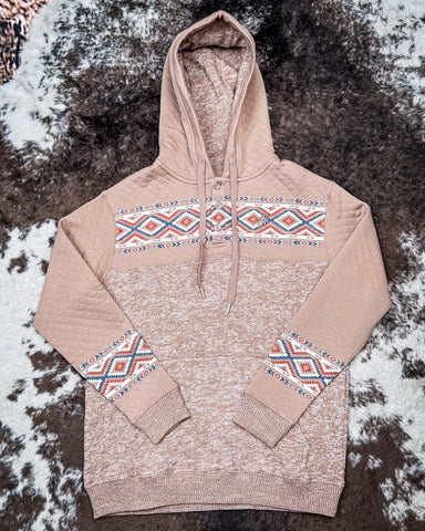 Jimmy Ladies Hooey Hoodie in Portabella with Aztec pattern being displayed on cowhide.