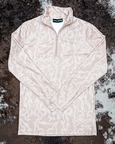 Beige patterned pullover on a textured surface