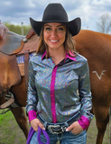 A model wearing the  Rodeo Voltage Pullover in front of a horse.