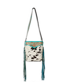 Front view of the Pony Trail Fringed Hand-Tooled Bag in a white back drop.
