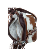 Inside of the Carved Blossoms Leather & Hairon Bag in a white back drop.