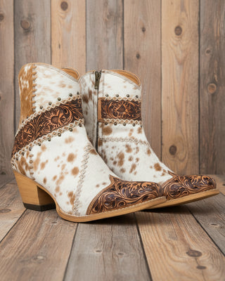Cowboy boots with white and brown pattern on a white background