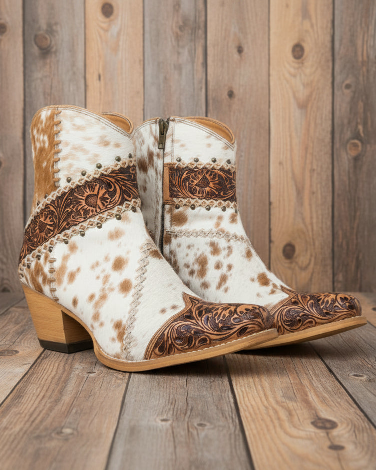 Cowboy boots with white and brown pattern on a white background