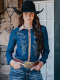 Woman wearing a mid-weight denim long sleeve button up with western swirl embroidery