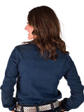 Woman wearing a mid-weight denim long sleeve button up with western swirl embroidery