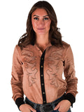 Woman wearing a tan mid-weight stretch suede button up with black trim and western swirl embroidery