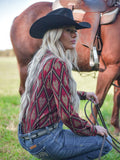 Woman wearing a red shimmer diamond print button up shirt with long sleeves