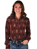 Woman wearing a red shimmer diamond print button up shirt with long sleeves