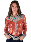 Woman wearing a rust metallic long sleeve button up shirt with colorful paisley trim