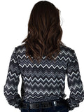 Woman wearing a grayscale chevron print button up shirt.