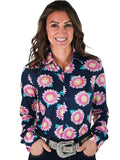 Woman wearing a navy button up shirt with pink and yellow sunflower print