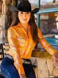 Woman wearing an orange metallic long sleeve quarter zip shirt with subtle pattern texture
