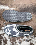 Very G black and white cow print slippers with faux fur lining and durable non-slip sole, cozy western women’s indoor outdoor shoes