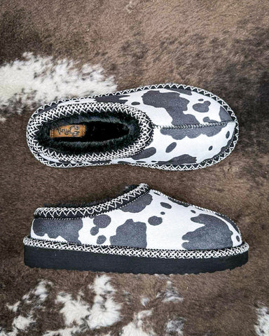 Very G black and white cow print slippers with faux fur lining and durable non-slip sole, cozy western women’s indoor outdoor shoes