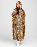 Person wearing a leopard print blanket hoodie against a white background