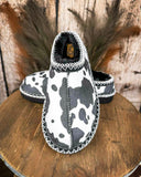 Very G black and white cow print slippers with faux fur lining and durable non-slip sole, cozy western women’s indoor outdoor shoes