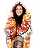 Person wearing a colorful patterned hoodie on a white background