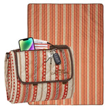 Striped picnic blanket with a pouch on a white background