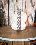 Top view of the Aztec Earmuff to show the design, sitting on a wooden table.
