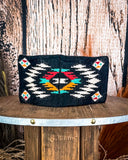 Back of the Aztec Head Wrap displayed on a wooden table with a wood back ground.