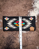 The Aztec Head Wrap, shown on a cowhide backdrop with a ruler indicating it measures about 4 inches wide.