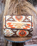 Patterned picnic blanket on a wooden stand with a rustic background