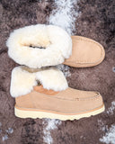 Bootie displayed on cowhide.