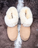 Bootie displayed on cowhide.