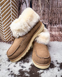 Bootie displayed on cowhide.