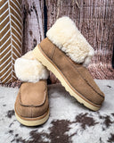 Bootie displayed on cowhide.