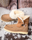 Bootie displayed on cowhide.
